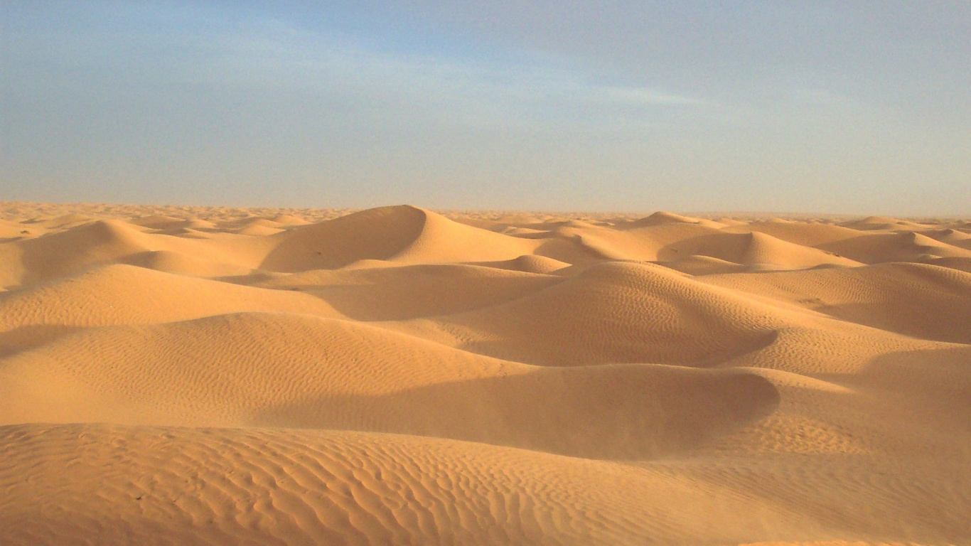Brown Sand Under Blue Sky During Daytime. Wallpaper in 1366x768 Resolution