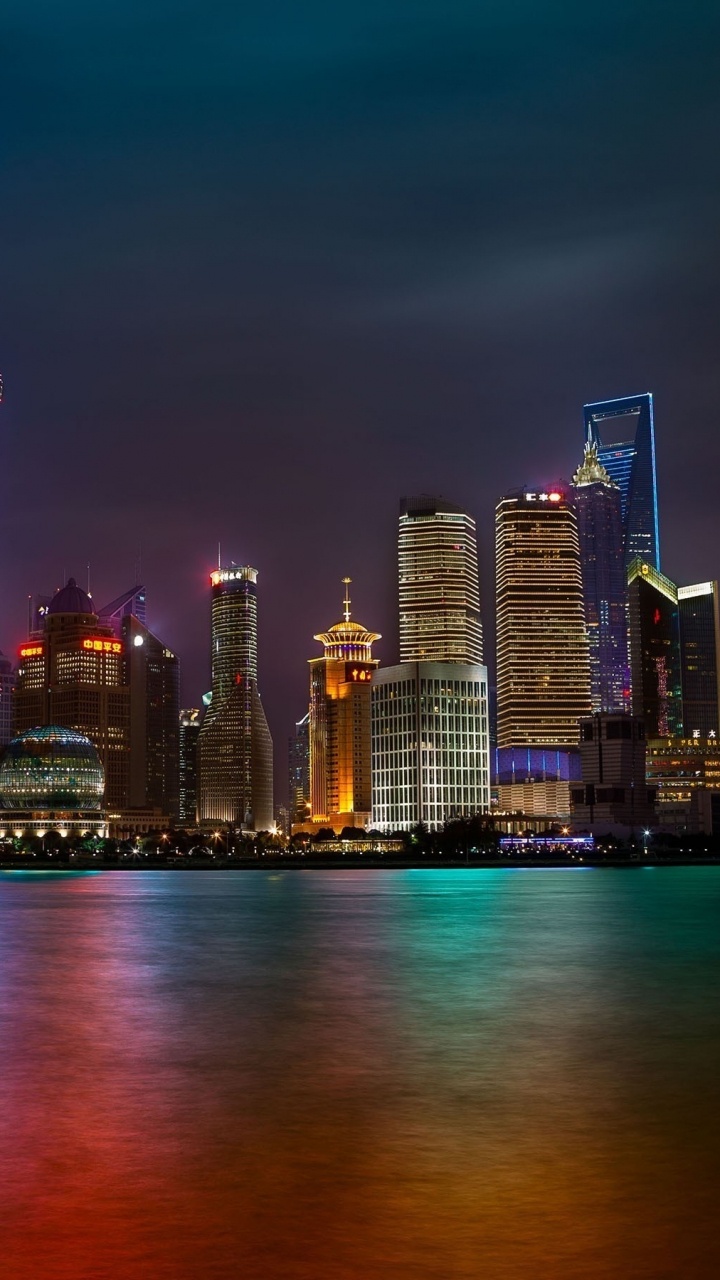 City Skyline During Night Time. Wallpaper in 720x1280 Resolution