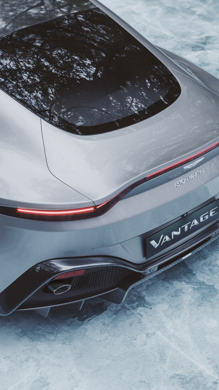 Porsche 911 Blanche et Noire Sur Sol Couvert de Neige. Wallpaper in 750x1334 Resolution