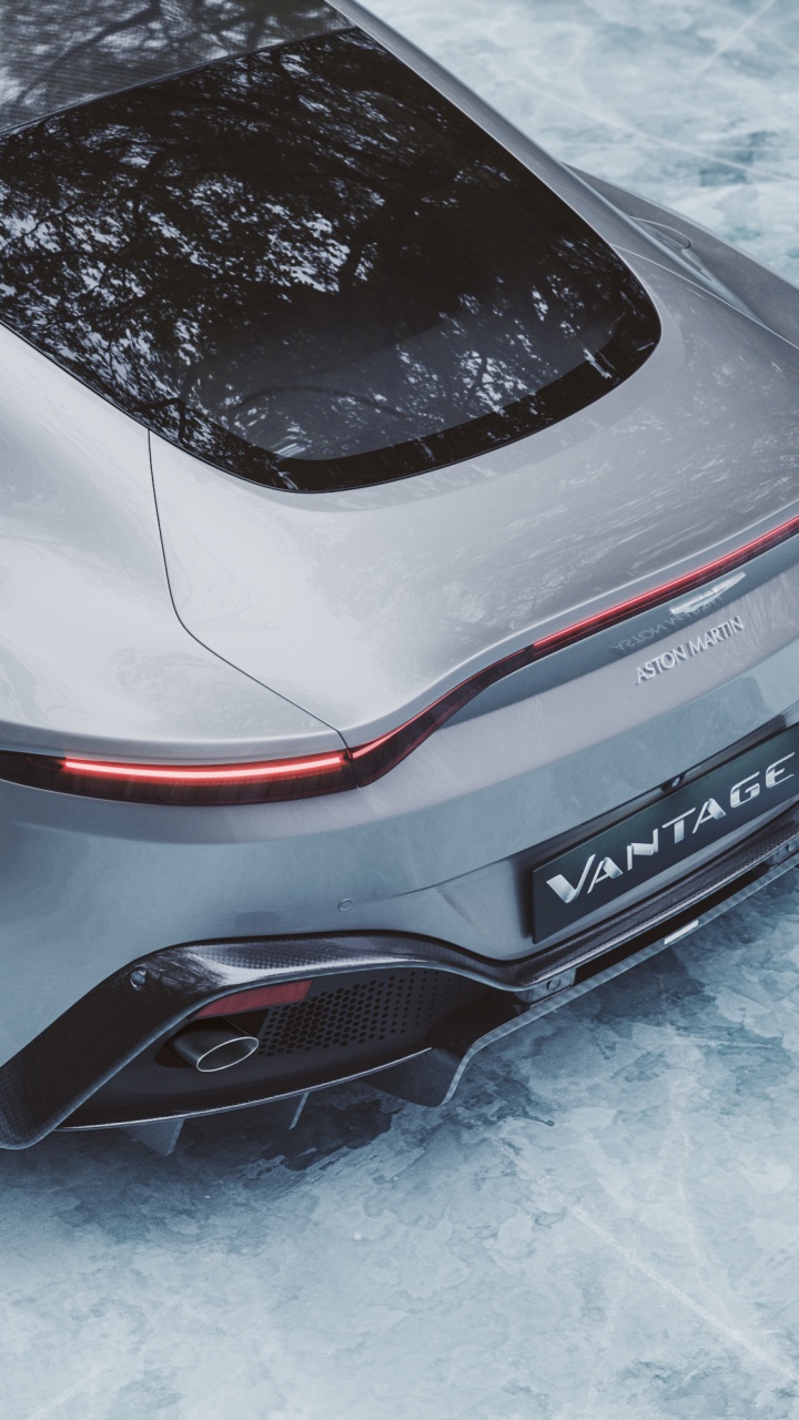 White and Black Porsche 911 on Snow Covered Ground. Wallpaper in 720x1280 Resolution