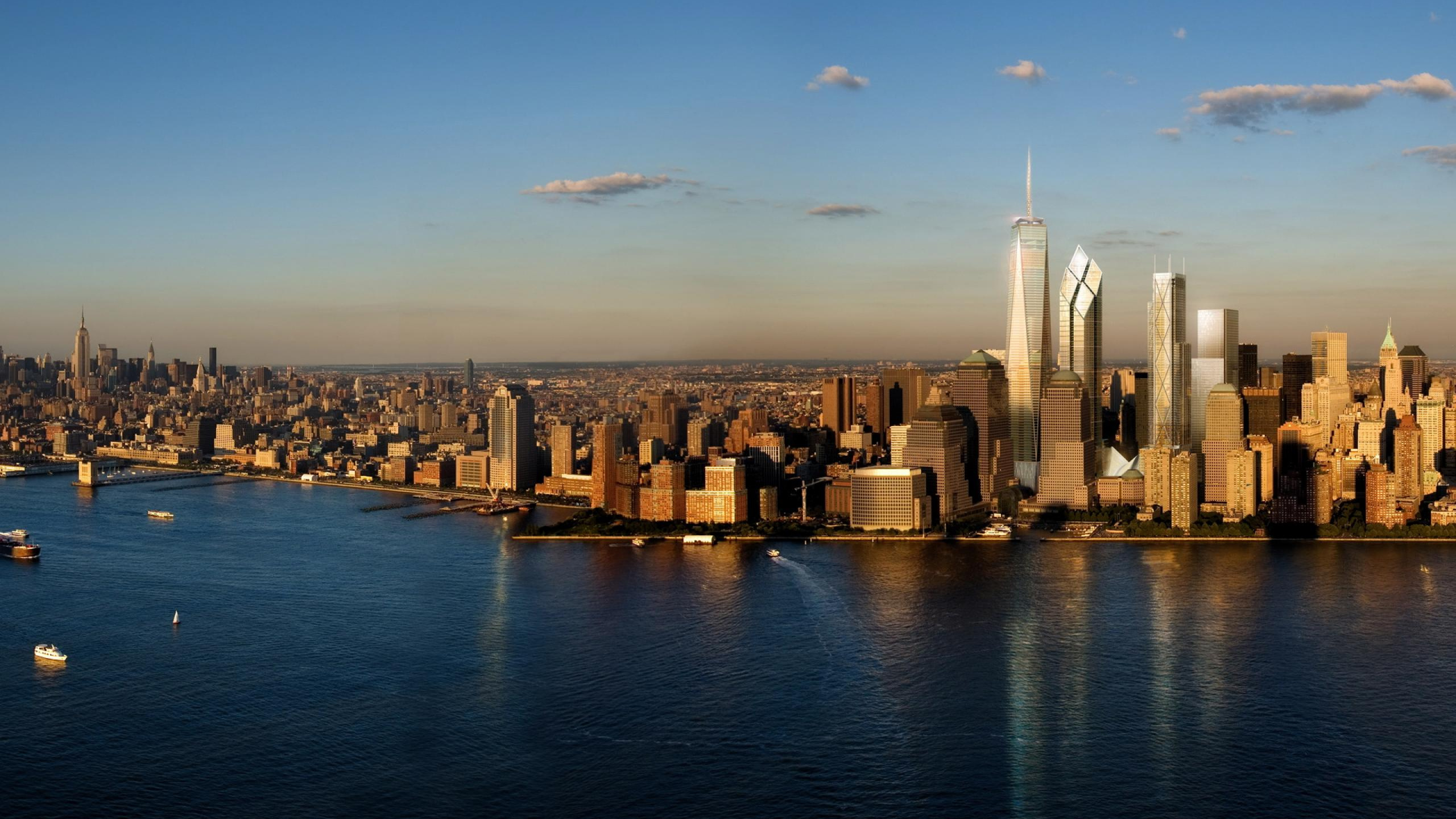 Skyline Der Stadt Über Gewässer Während Des Tages. Wallpaper in 2560x1440 Resolution