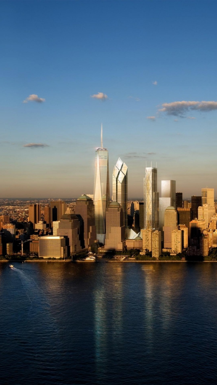 Skyline Der Stadt Über Gewässer Während Des Tages. Wallpaper in 720x1280 Resolution