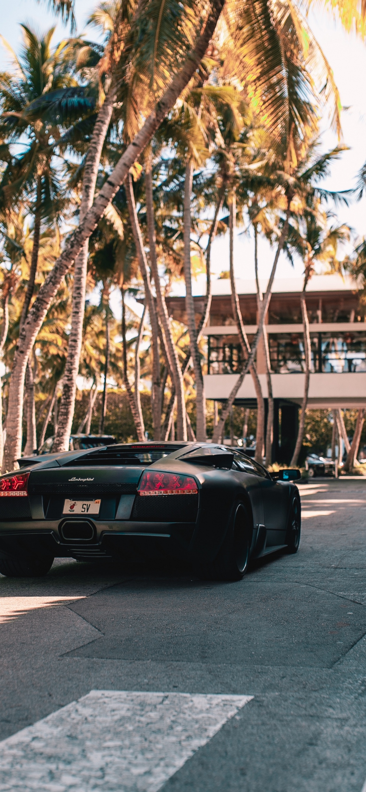 Black Porsche 911 Parked on Road During Daytime. Wallpaper in 1242x2688 Resolution