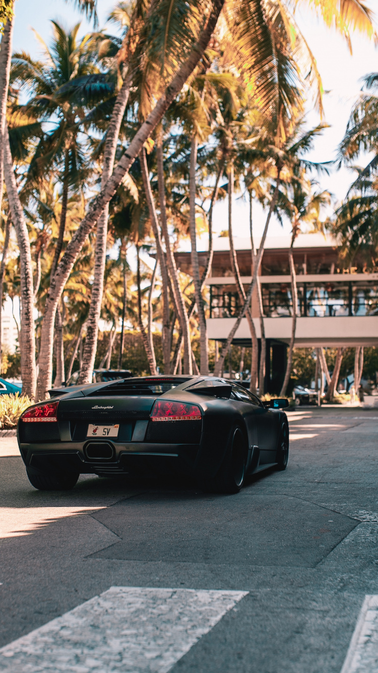 Black Porsche 911 Parked on Road During Daytime. Wallpaper in 750x1334 Resolution