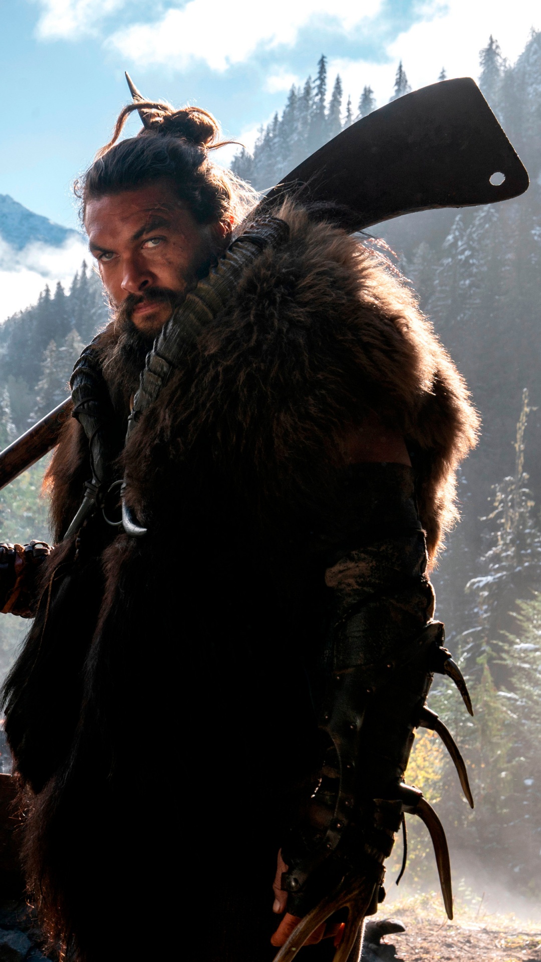 Man in Brown Parka Jacket Holding Brown Stick. Wallpaper in 1080x1920 Resolution