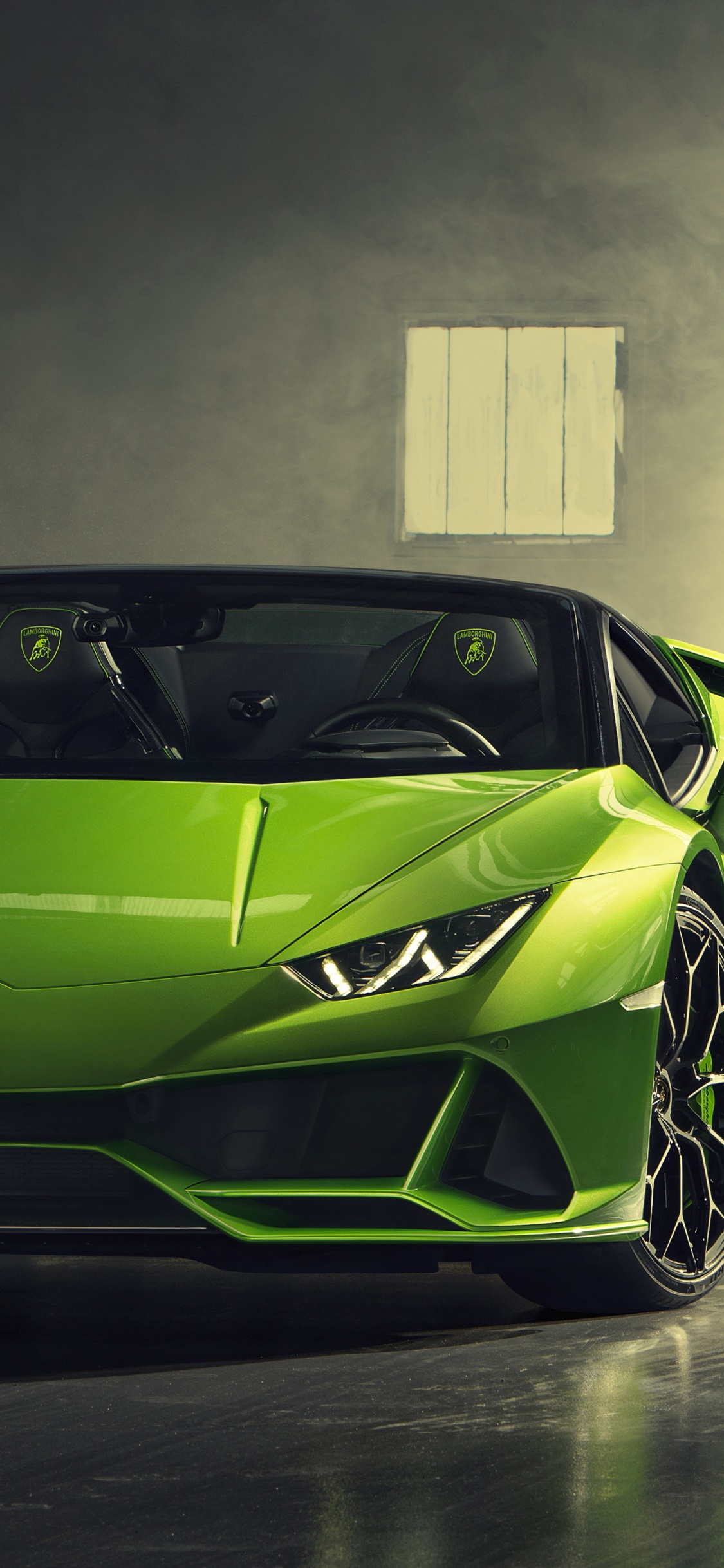 Yellow Lamborghini Aventador in a Room. Wallpaper in 1125x2436 Resolution