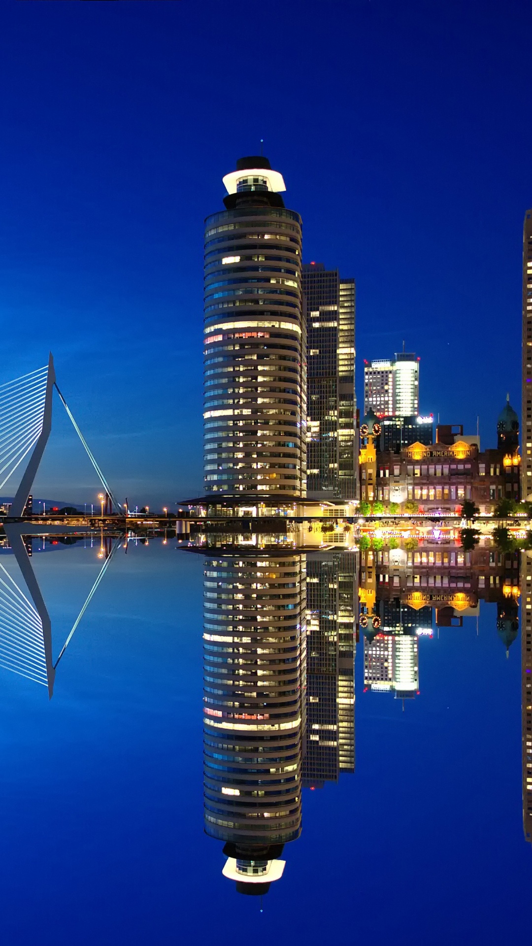 Bridge Over Water Near City Buildings During Night Time. Wallpaper in 1080x1920 Resolution