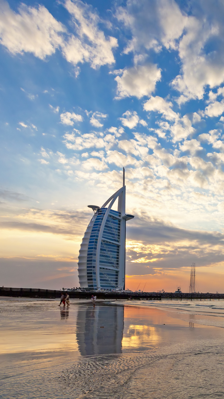 White and Blue Boat on Sea Under Blue Sky and White Clouds During Daytime. Wallpaper in 750x1334 Resolution