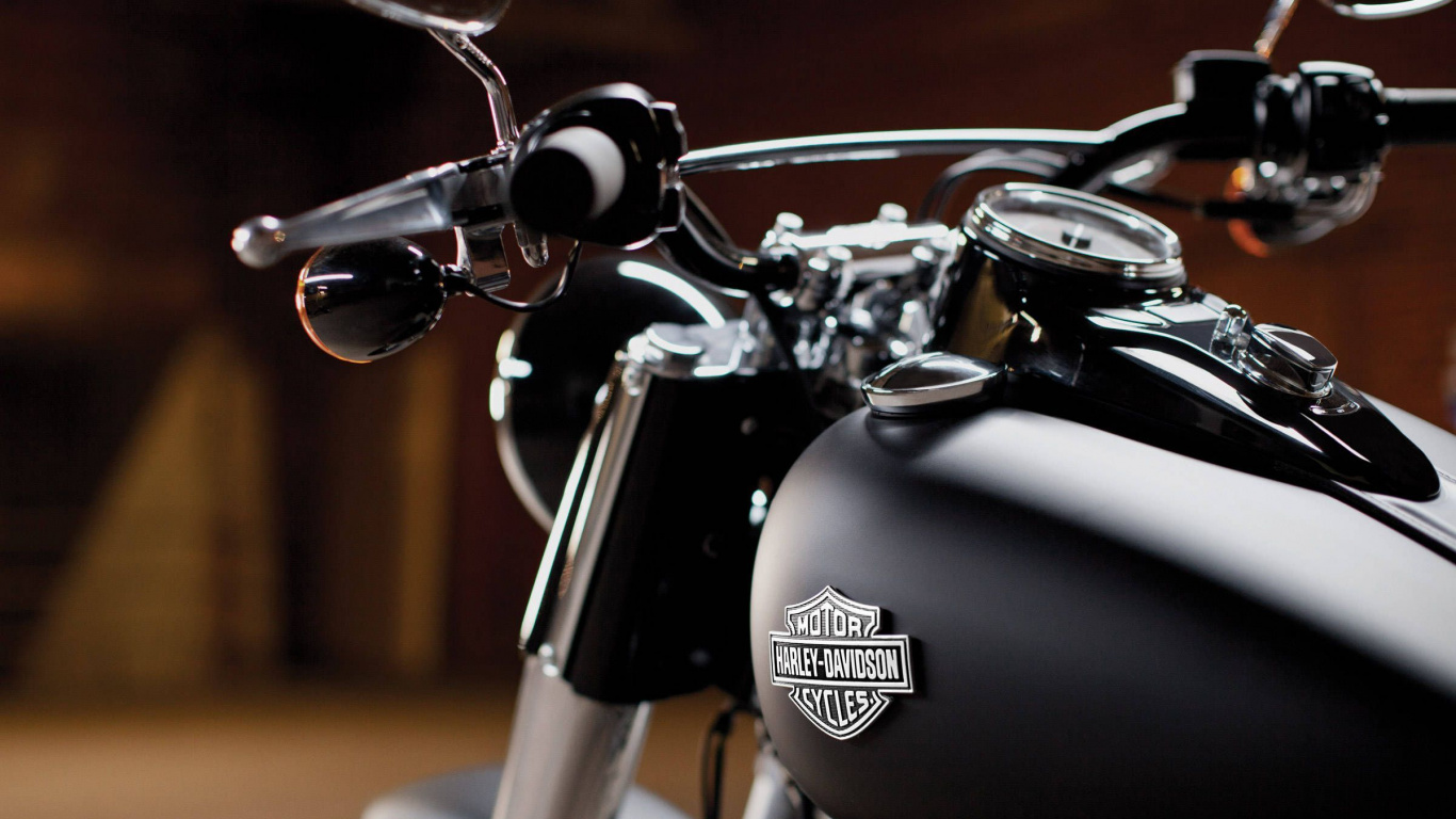 Black and Silver Motorcycle on Brown Concrete Floor. Wallpaper in 1366x768 Resolution