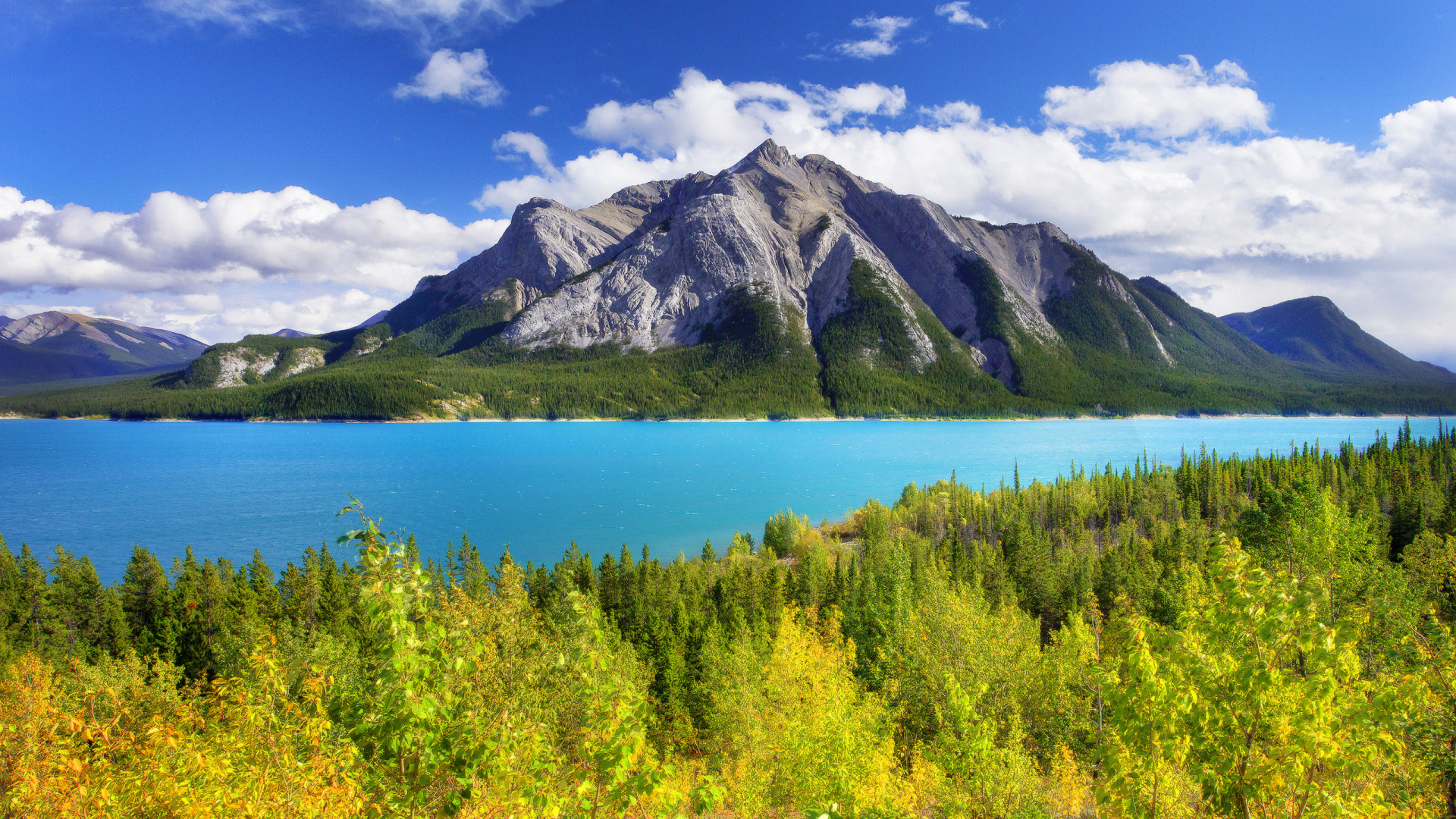 Green Mountain Beside Body of Water Under Blue Sky During Daytime. Wallpaper in 1920x1080 Resolution
