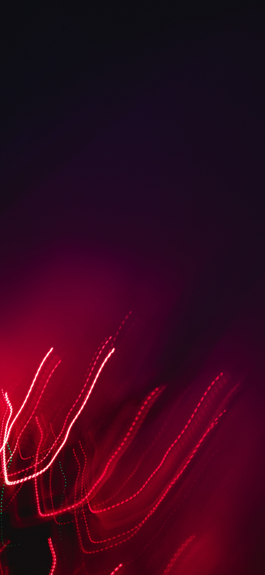 Rotes Licht Auf Schwarzem Hintergrund. Wallpaper in 1125x2436 Resolution