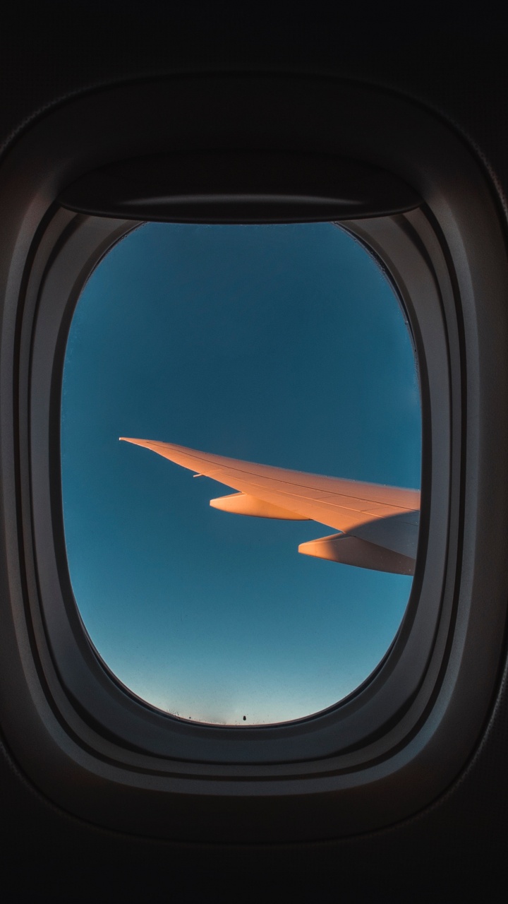 Blue and White Airplane Window. Wallpaper in 720x1280 Resolution
