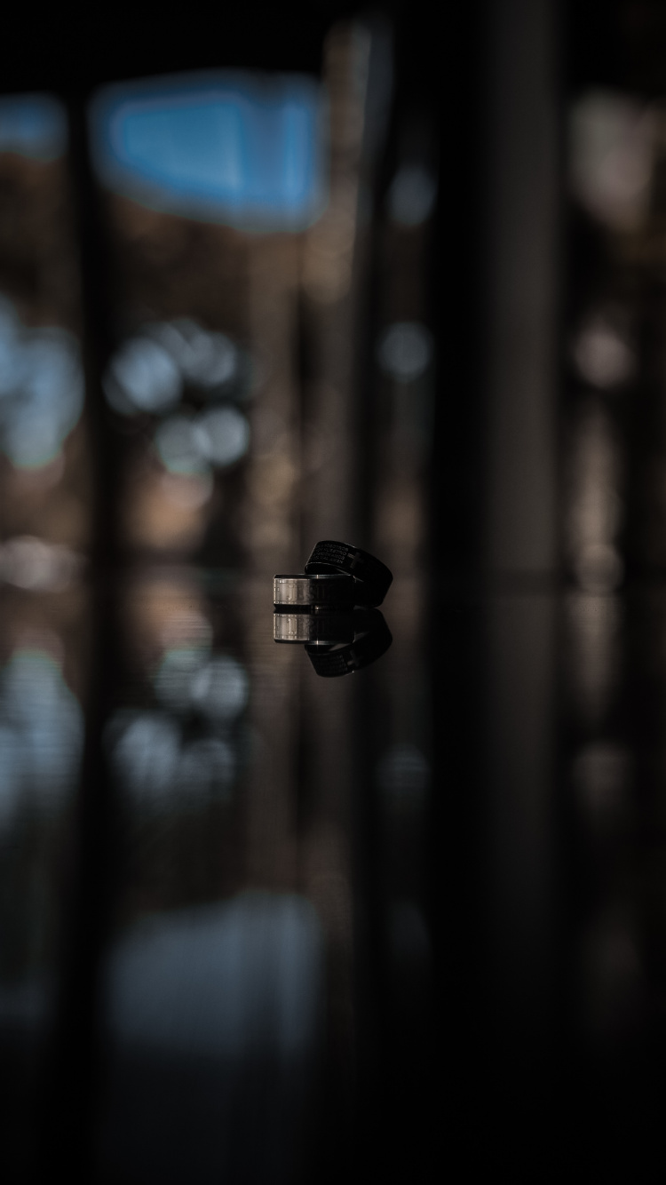 Black Lantern in Bokeh Photography. Wallpaper in 750x1334 Resolution