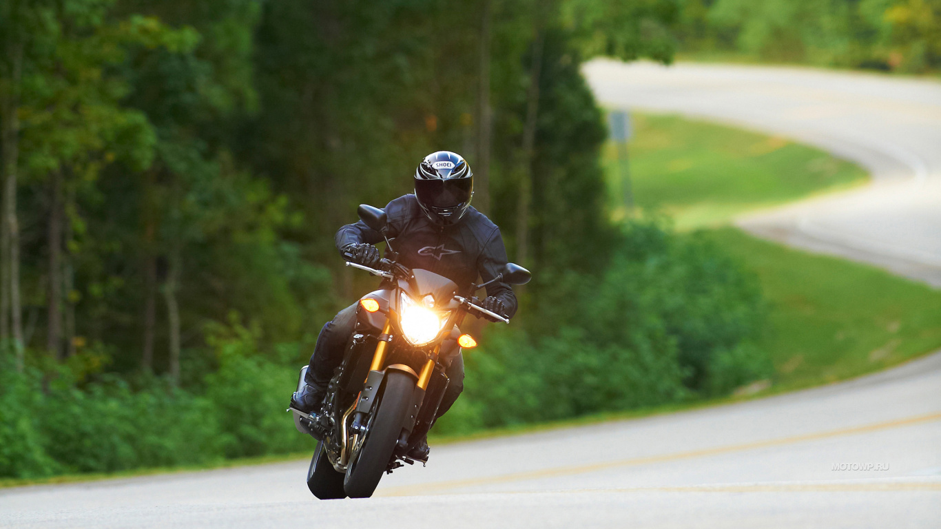 Man in Black Helmet Riding Yellow Motorcycle on Road During Daytime. Wallpaper in 1366x768 Resolution