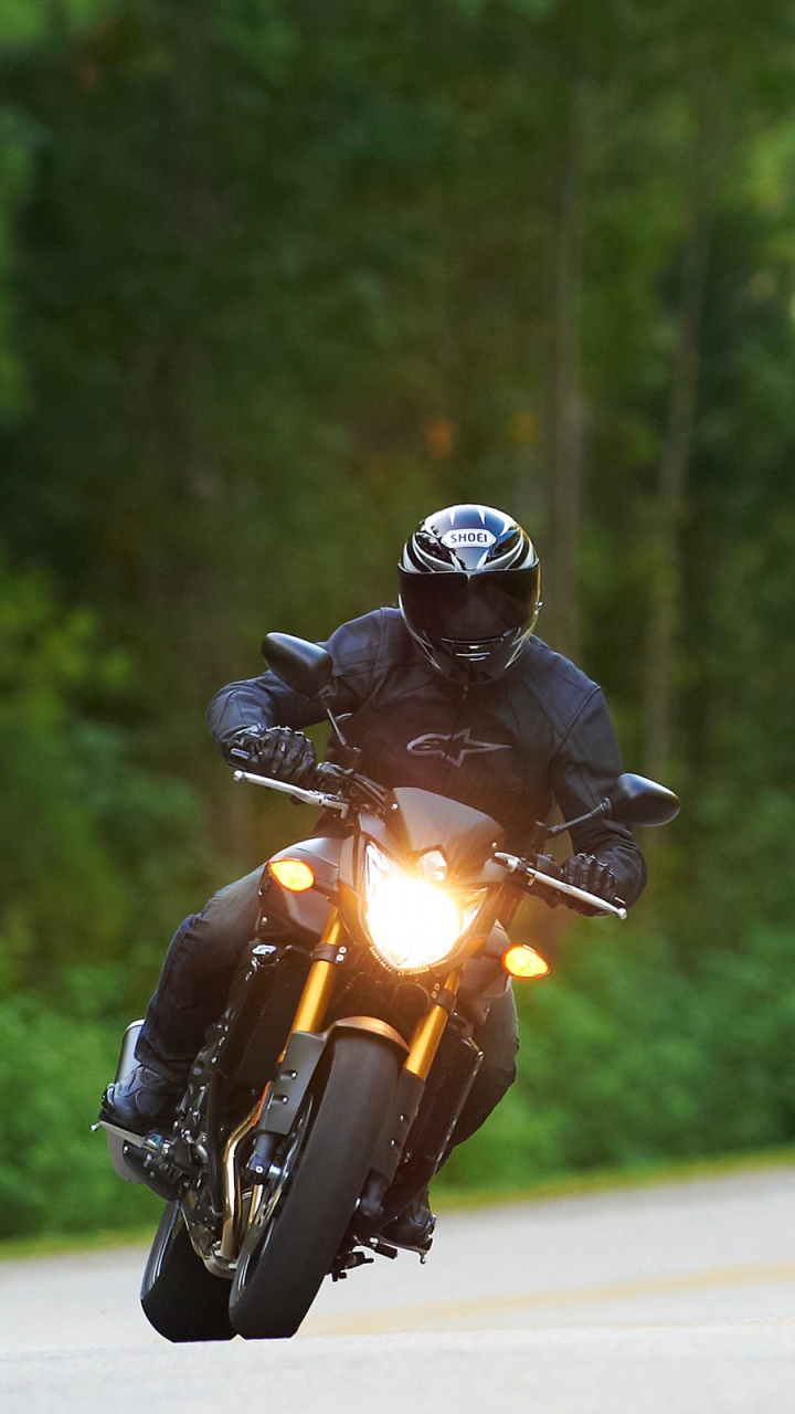 Man in Black Helmet Riding Yellow Motorcycle on Road During Daytime. Wallpaper in 720x1280 Resolution