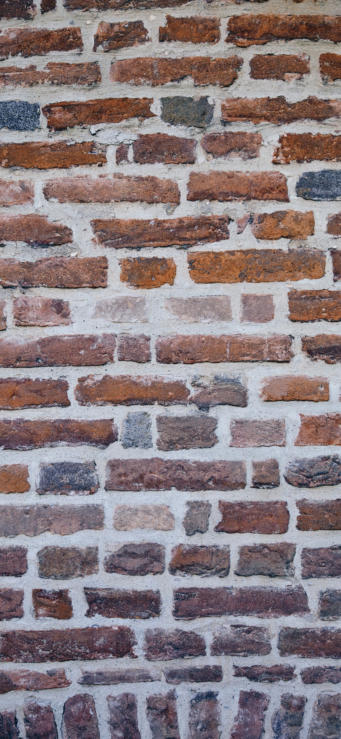 Brown and Black Brick Wall. Wallpaper in 1125x2436 Resolution