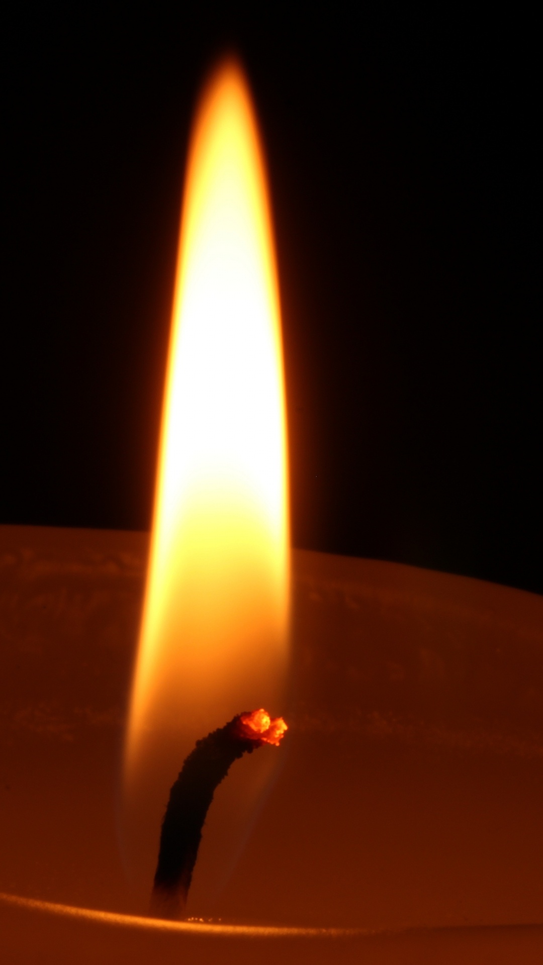 Lighted Candle in Dark Room. Wallpaper in 1080x1920 Resolution