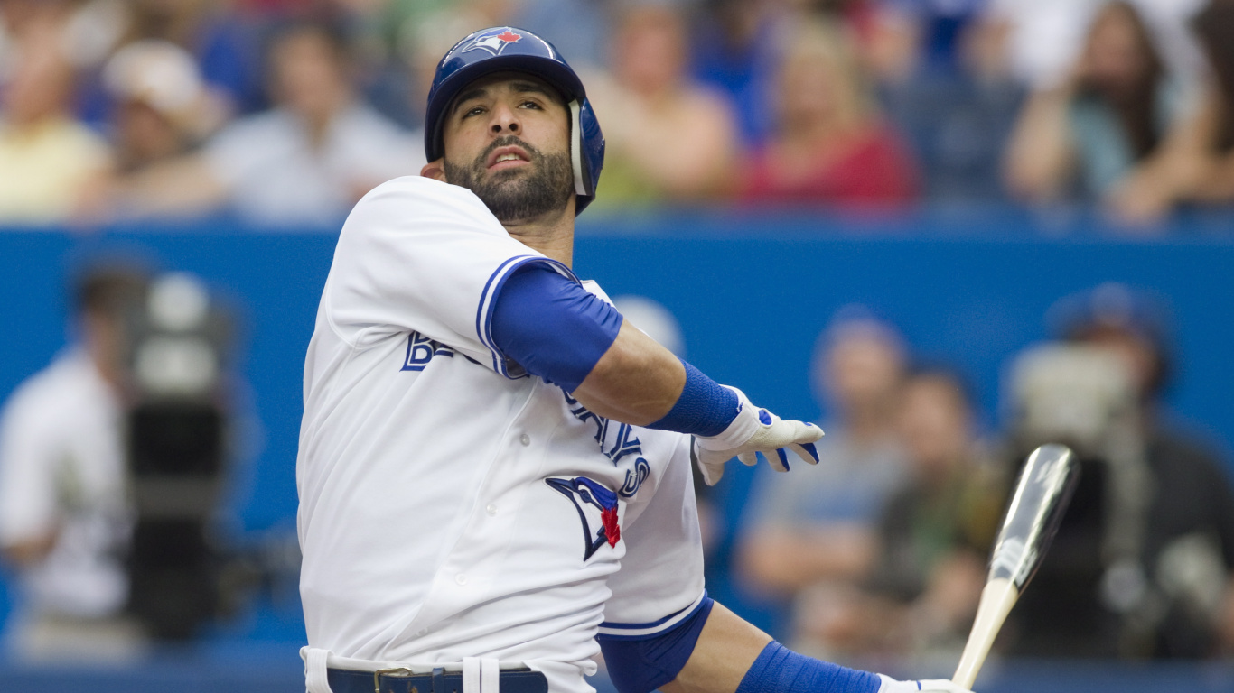 Man in White and Blue Nike Jersey Shirt Holding Baseball Bat. Wallpaper in 1366x768 Resolution