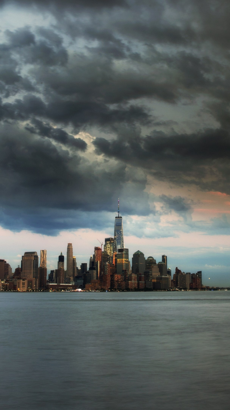 City Skyline Under Cloudy Sky During Daytime. Wallpaper in 750x1334 Resolution