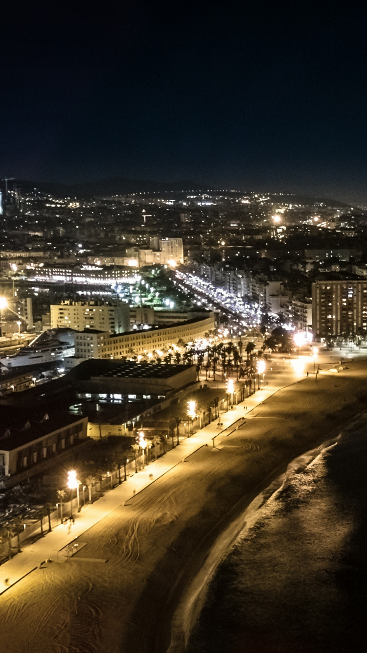 City Lights Turned on During Night Time. Wallpaper in 750x1334 Resolution