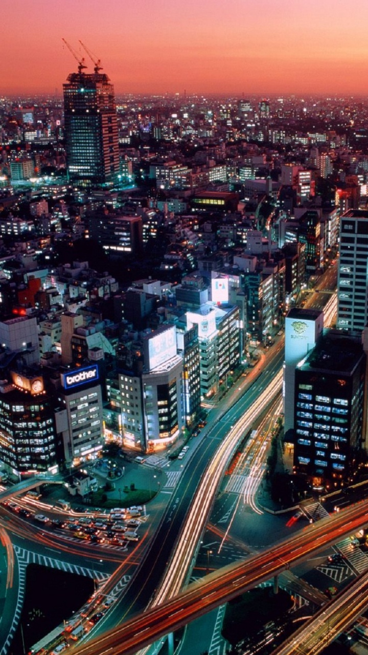 City Buildings During Night Time. Wallpaper in 720x1280 Resolution