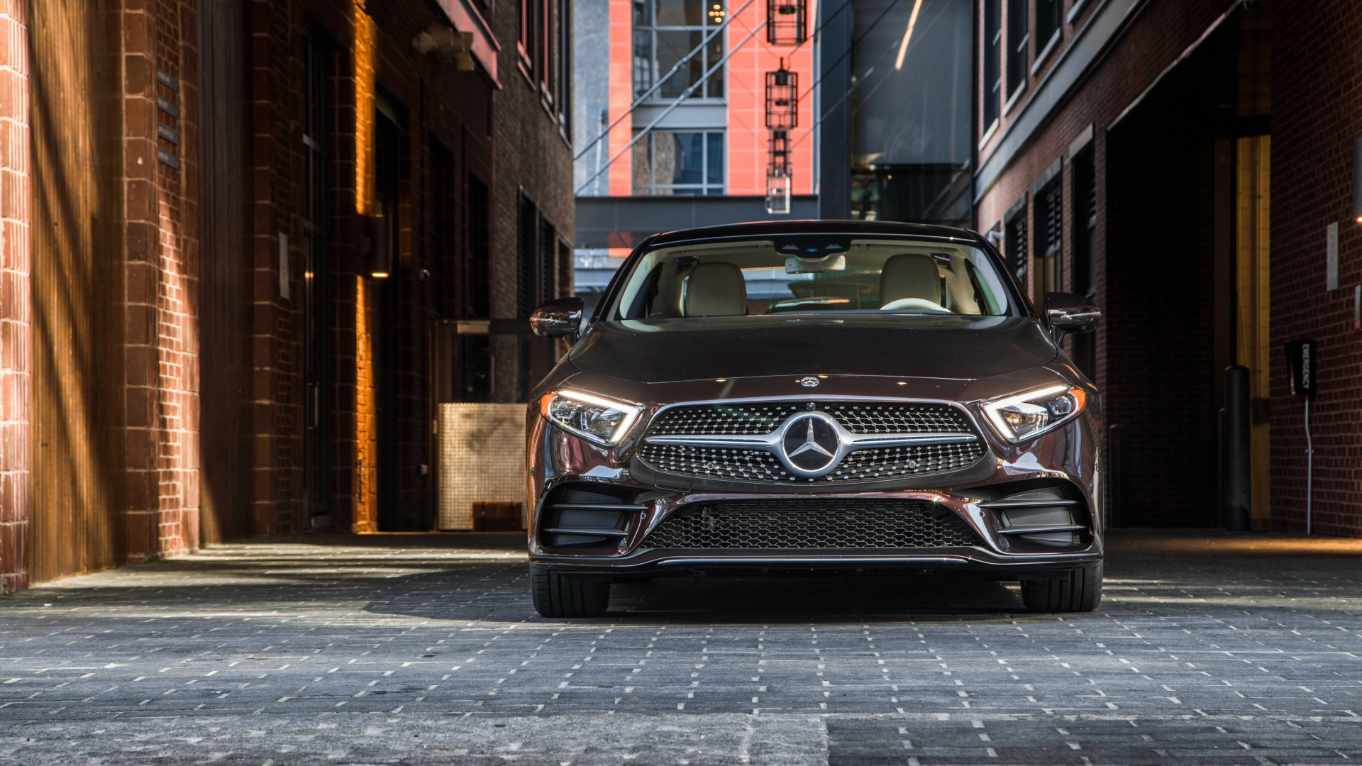 Black Mercedes Benz Car Parked Beside Brown Building During Daytime. Wallpaper in 1920x1080 Resolution