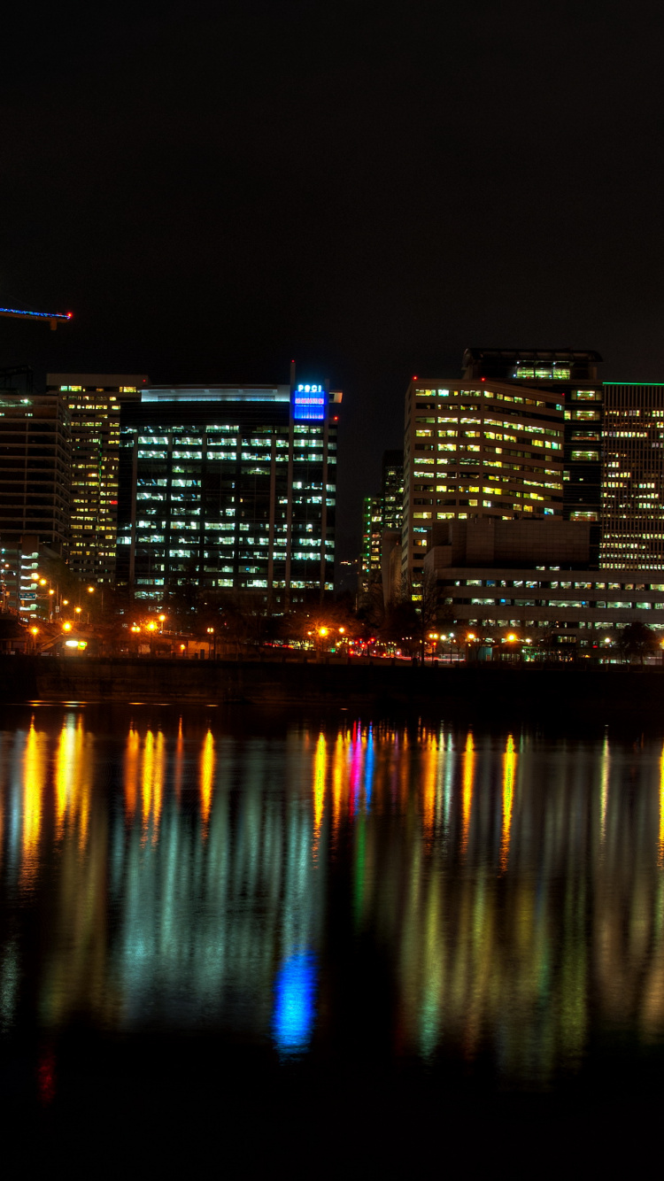 Bridge Over Water During Night Time. Wallpaper in 750x1334 Resolution