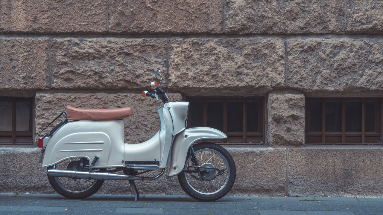 White and Brown Motor Scooter Parked Beside Brown Brick Wall. Wallpaper in 1280x720 Resolution