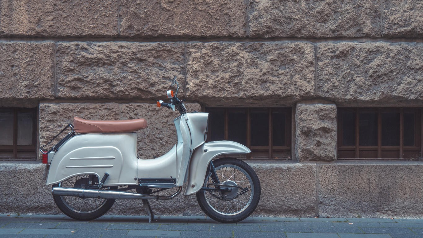 White and Brown Motor Scooter Parked Beside Brown Brick Wall. Wallpaper in 1366x768 Resolution