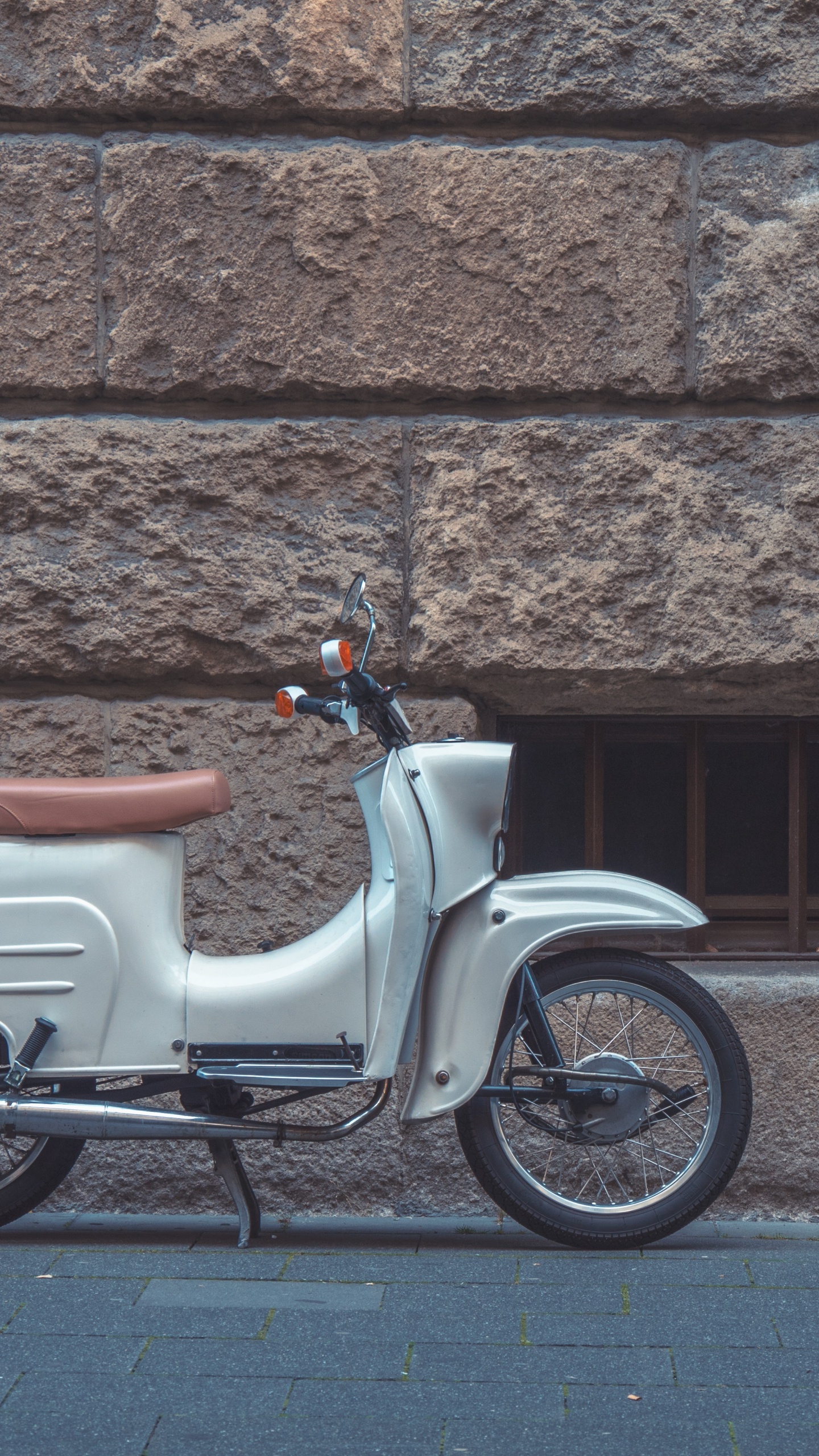 White and Brown Motor Scooter Parked Beside Brown Brick Wall. Wallpaper in 1440x2560 Resolution