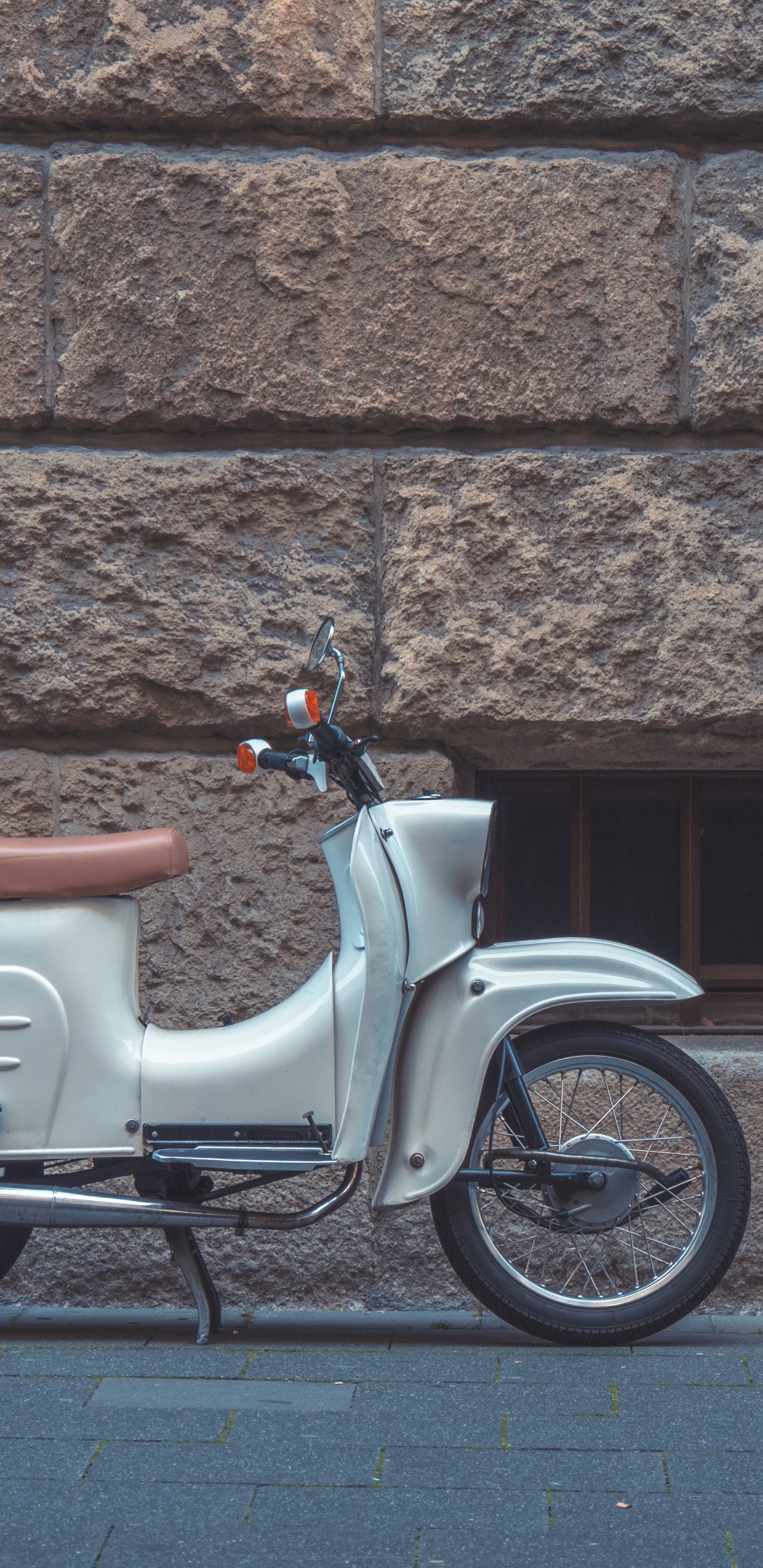 White and Brown Motor Scooter Parked Beside Brown Brick Wall. Wallpaper in 1440x2960 Resolution