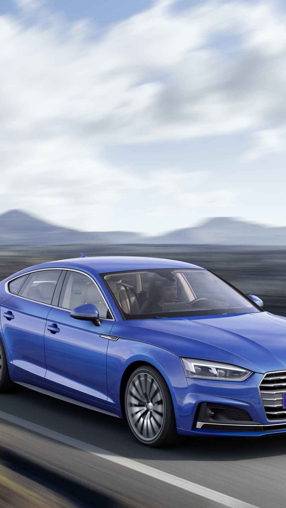 Blauer Audi a 4 Tagsüber Unterwegs. Wallpaper in 1080x1920 Resolution