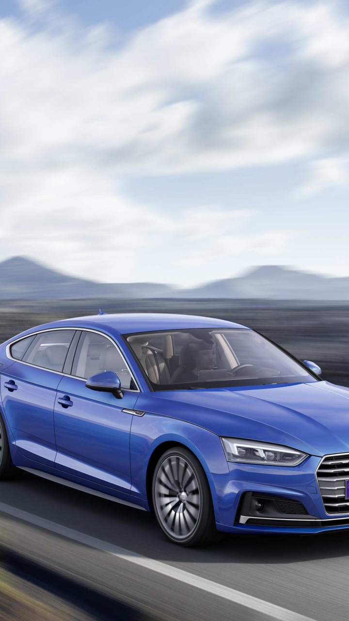 Audi a 4 Azul en la Carretera Durante el Día. Wallpaper in 720x1280 Resolution