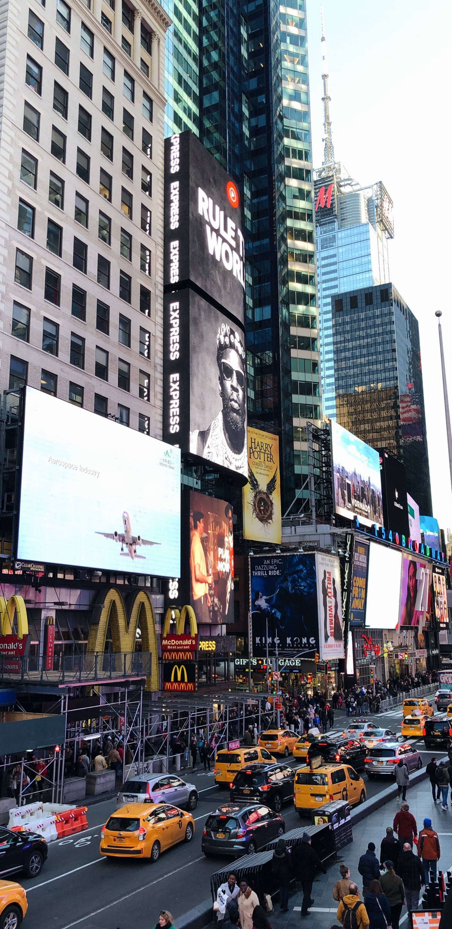 Cars on Road in Between High Rise Buildings During Daytime. Wallpaper in 1440x2960 Resolution