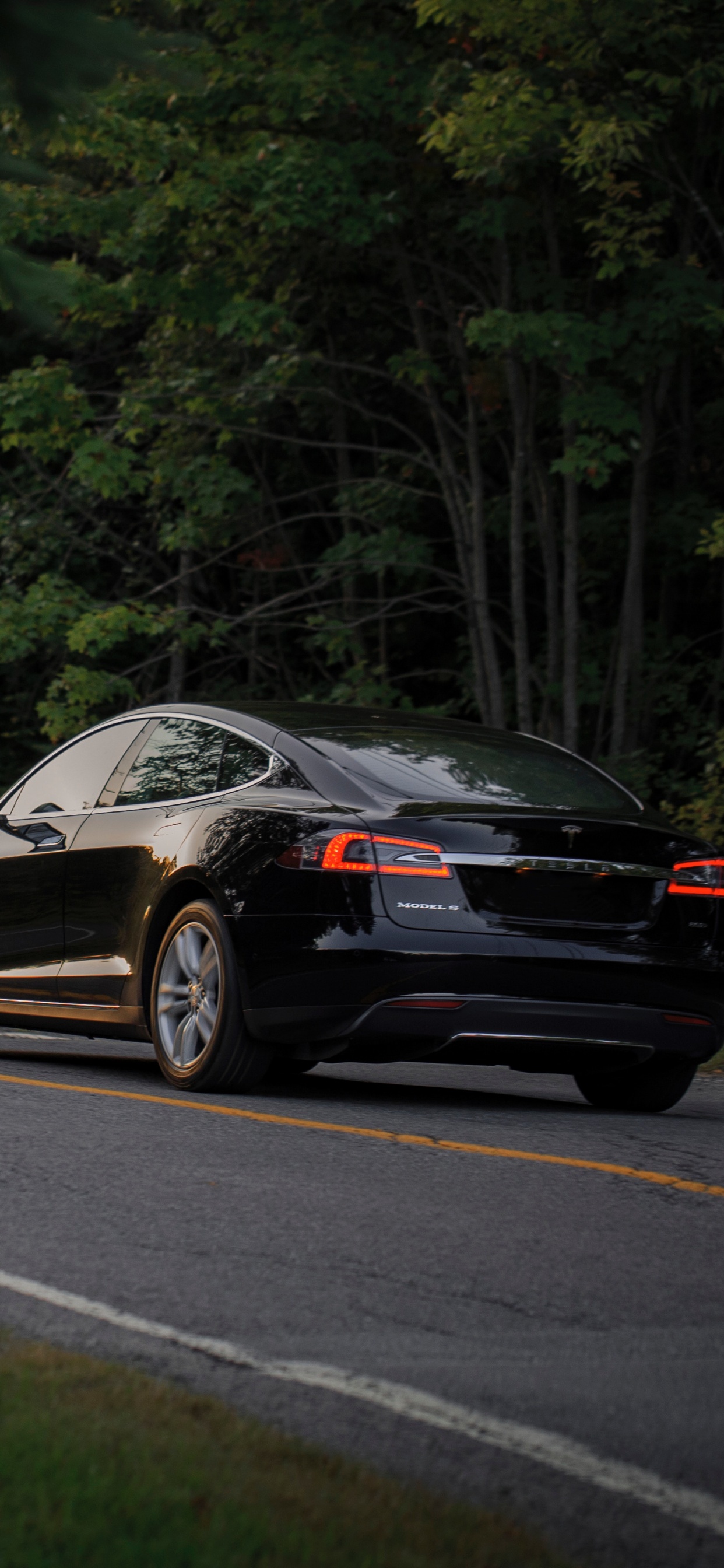 Black Porsche 911 on Road. Wallpaper in 1242x2688 Resolution