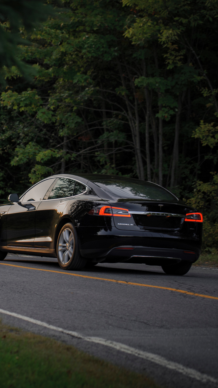 Black Porsche 911 on Road. Wallpaper in 750x1334 Resolution