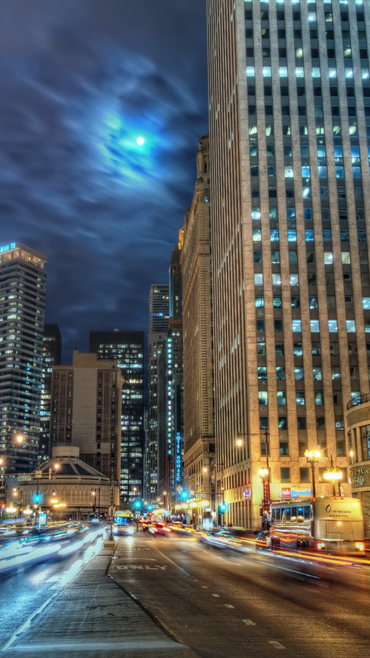 Cars on Road Near High Rise Buildings During Night Time. Wallpaper in 720x1280 Resolution