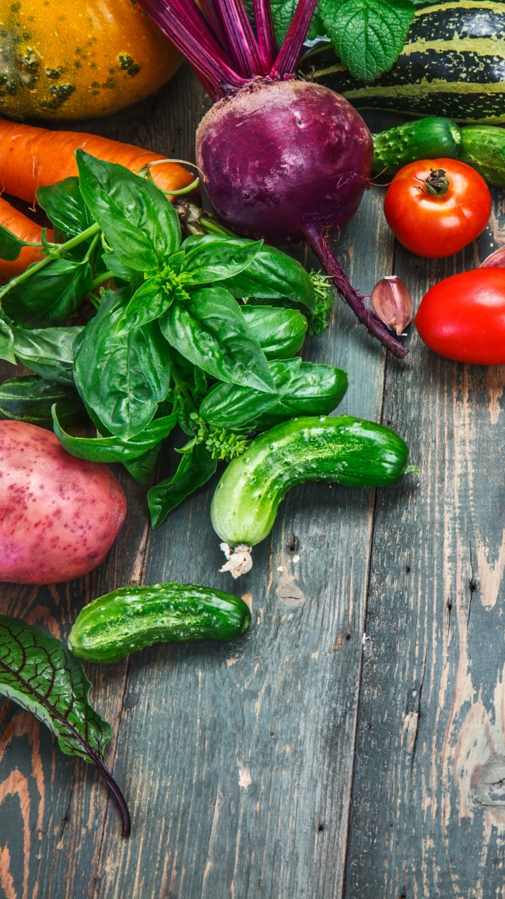 Red and Green Chili Peppers on Brown Wooden Table. Wallpaper in 720x1280 Resolution