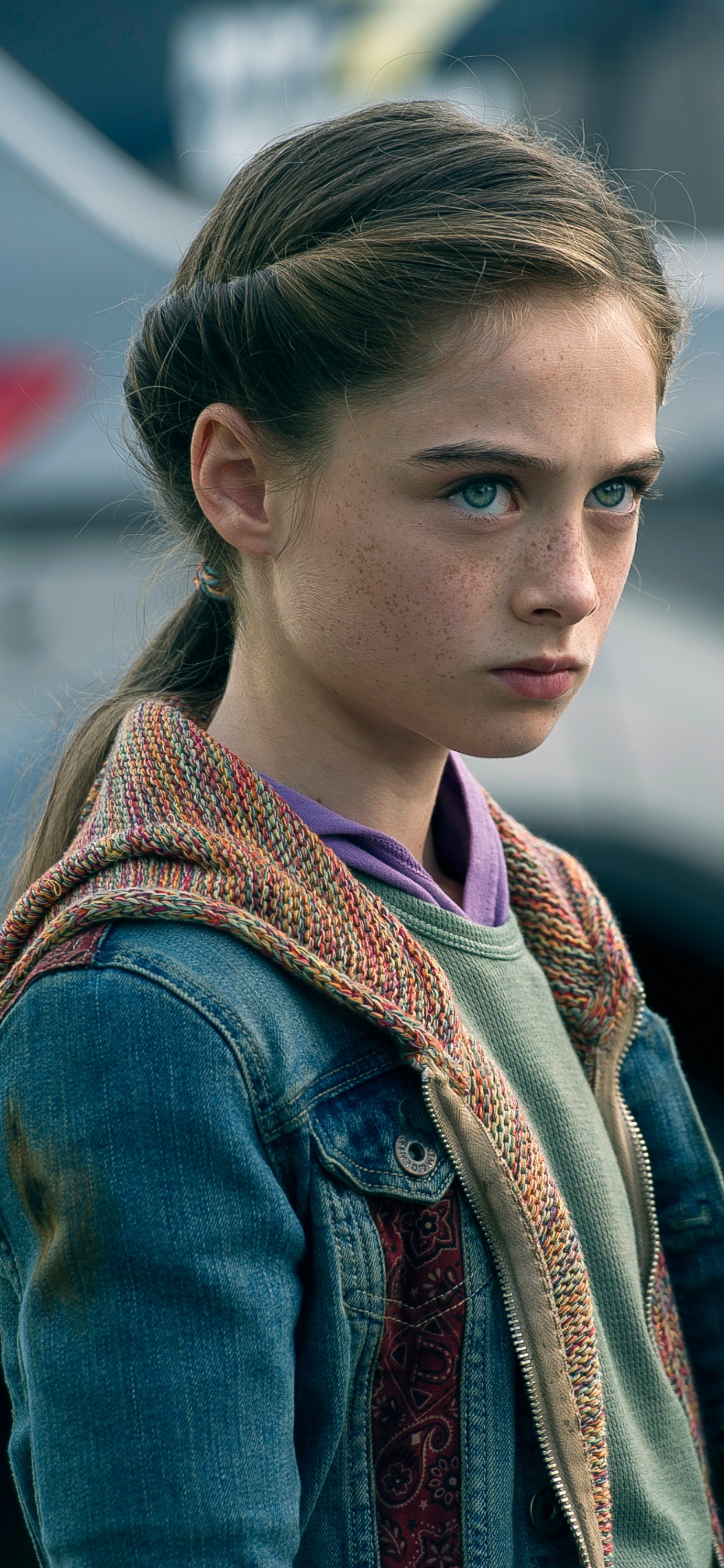 Woman in Blue Denim Jacket Standing Near Black Car During Daytime. Wallpaper in 1242x2688 Resolution