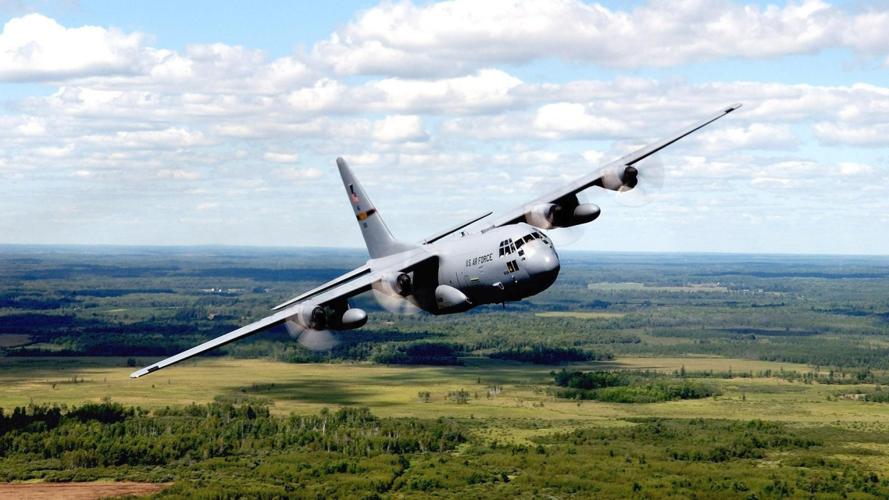 Black Airplane on Green Grass Field Under White Clouds and Blue Sky During Daytime. Wallpaper in 1280x720 Resolution