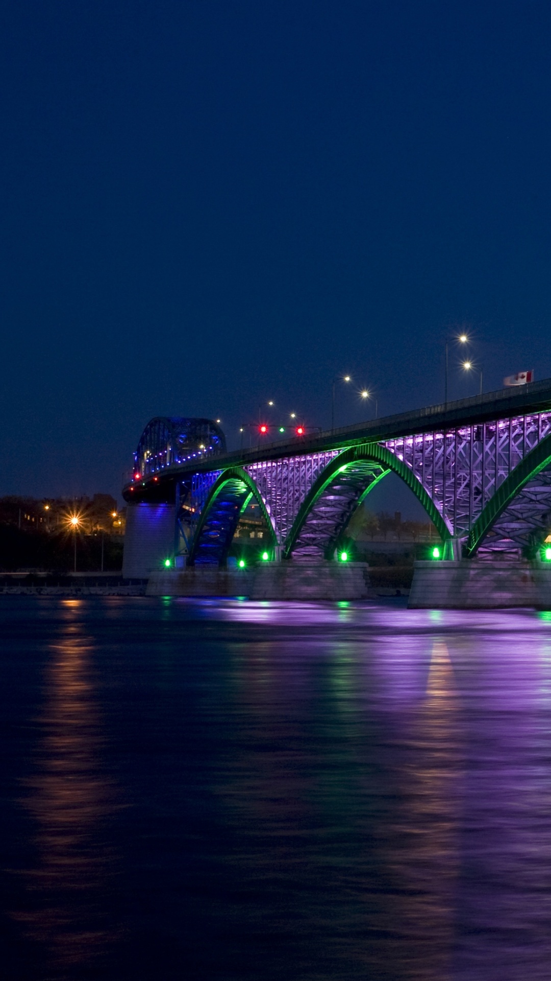 Gray Bridge Over Body of Water During Night Time. Wallpaper in 1080x1920 Resolution