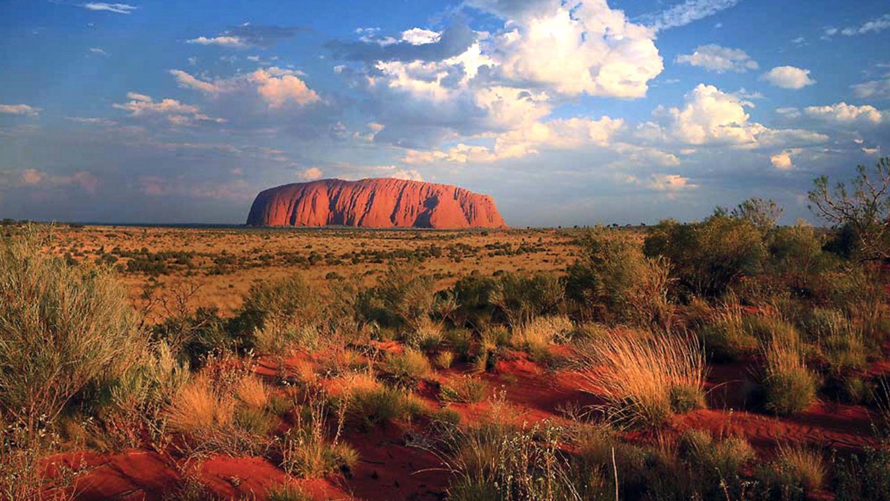 Brown Rock Formation Under White Clouds and Blue Sky During Daytime. Wallpaper in 1280x720 Resolution