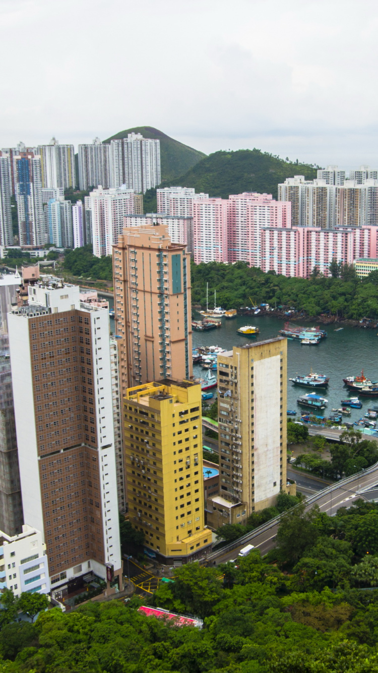 High Rise Buildings Near Body of Water During Daytime. Wallpaper in 750x1334 Resolution