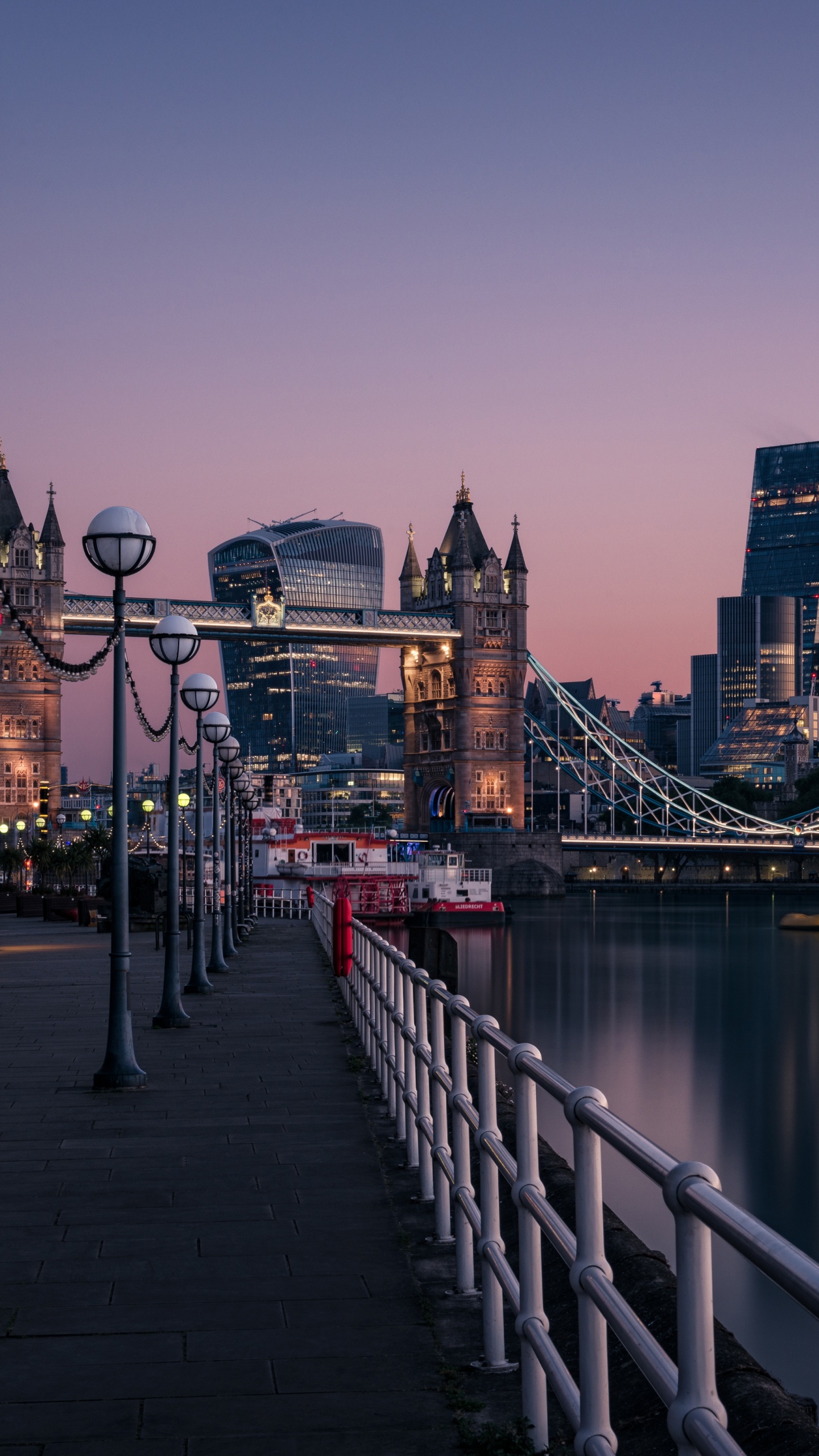 Bridge Over River Near City Buildings During Daytime. Wallpaper in 1440x2560 Resolution