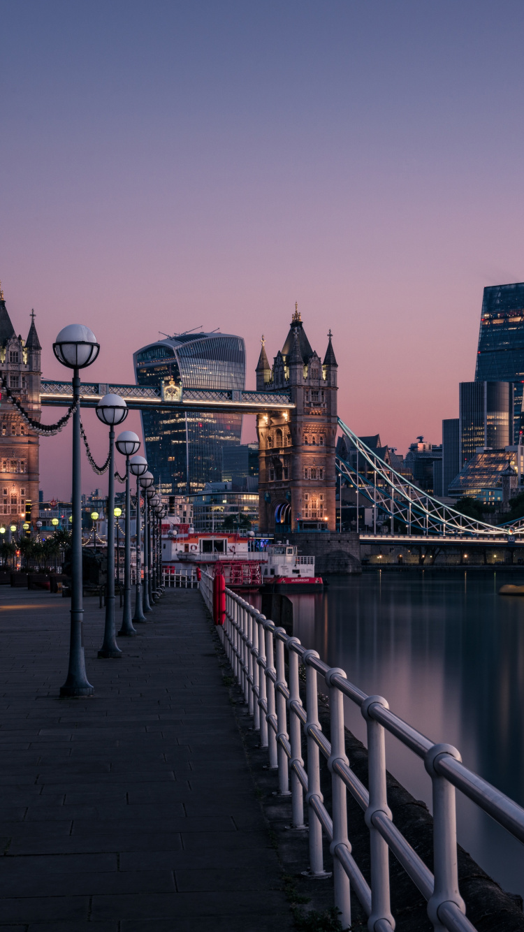 Bridge Over River Near City Buildings During Daytime. Wallpaper in 750x1334 Resolution