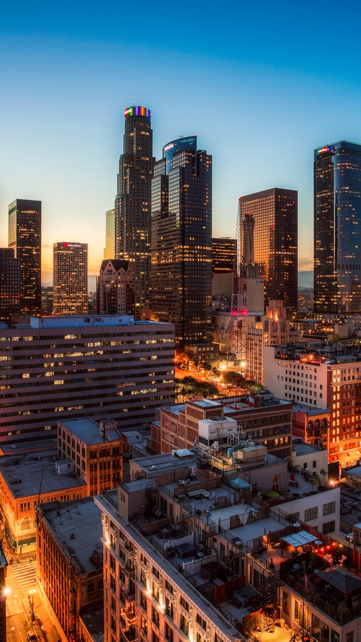 City Skyline During Night Time. Wallpaper in 720x1280 Resolution