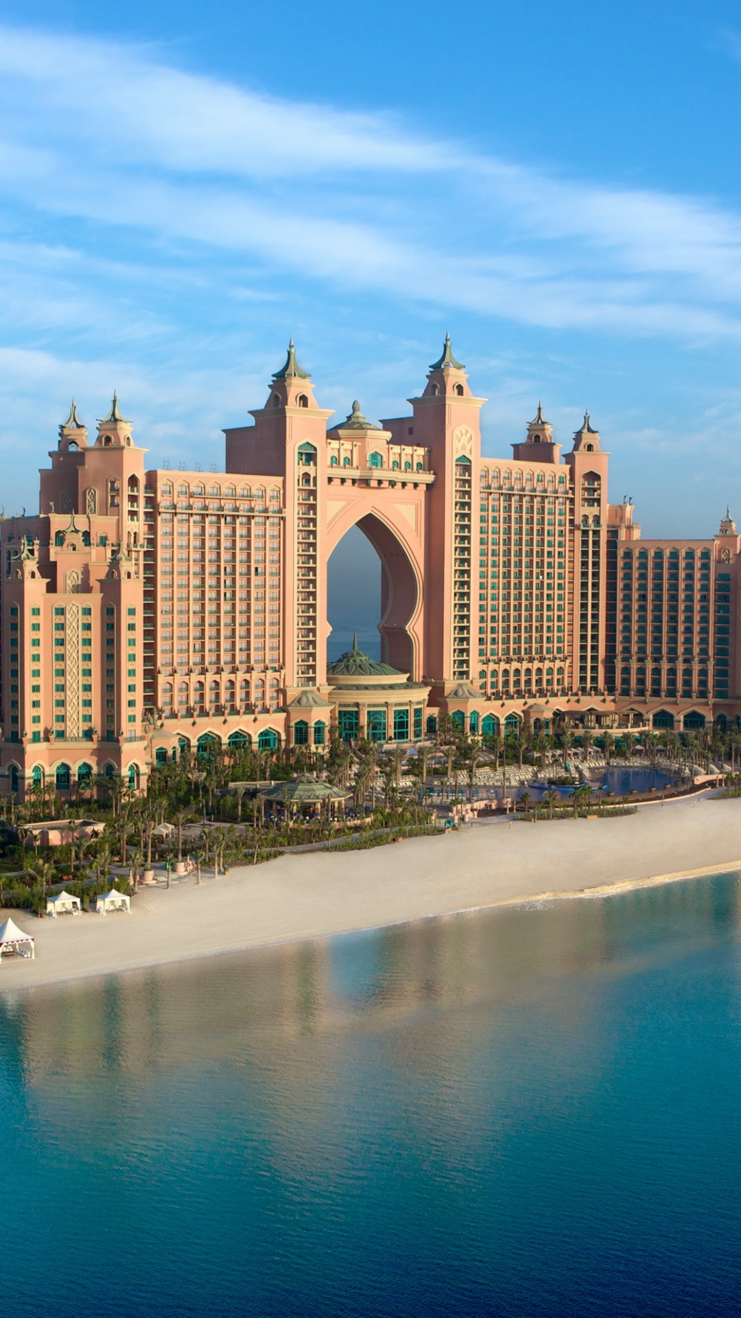 Brown Concrete Building Near Body of Water During Daytime. Wallpaper in 1080x1920 Resolution