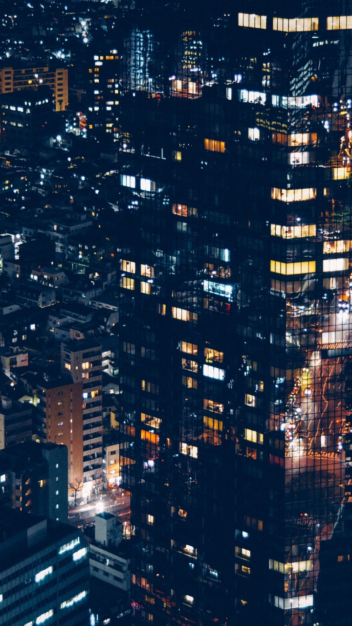 Vue Aérienne Des Bâtiments de la Ville Pendant la Nuit. Wallpaper in 720x1280 Resolution