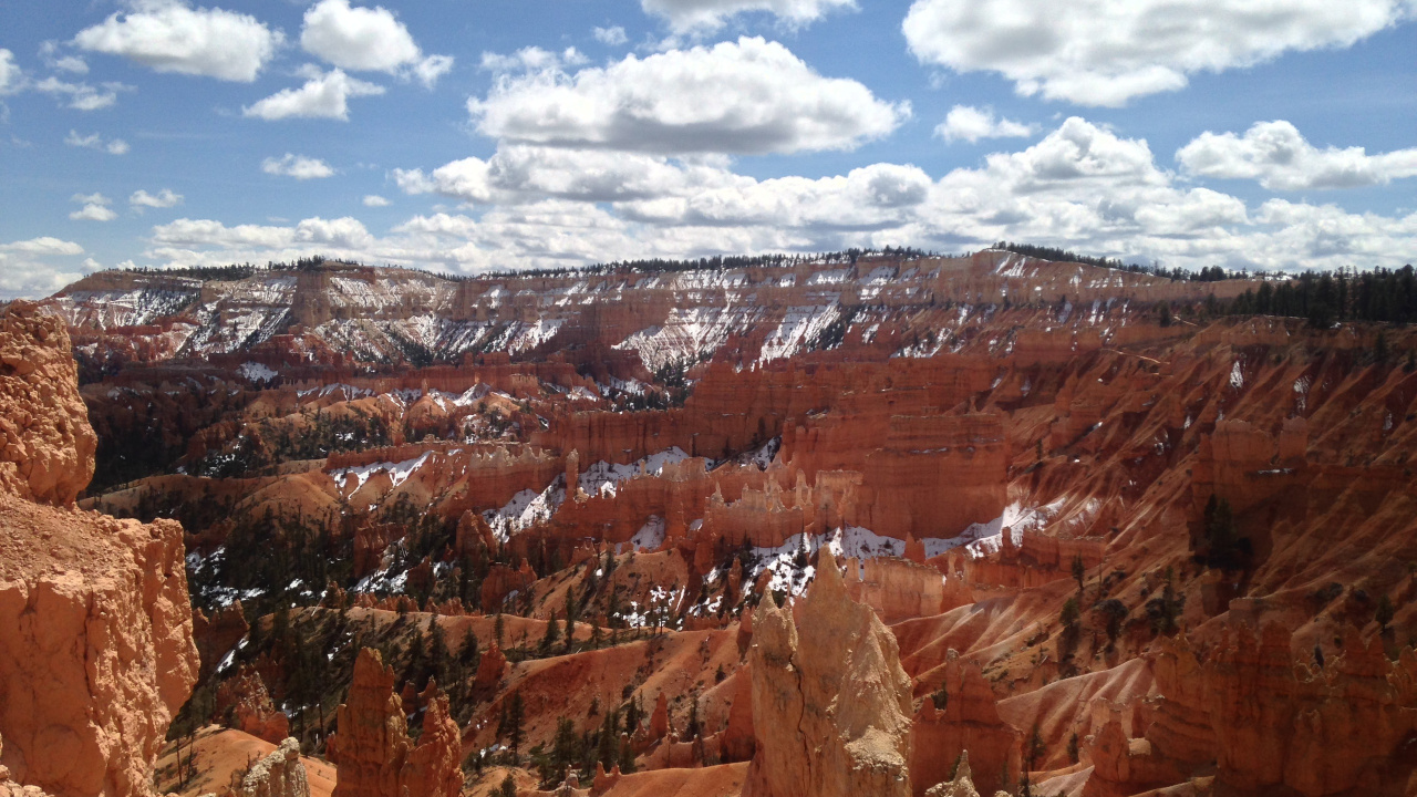 Brown Rocky Mountain Under Blue Sky and White Clouds During Daytime. Wallpaper in 1280x720 Resolution