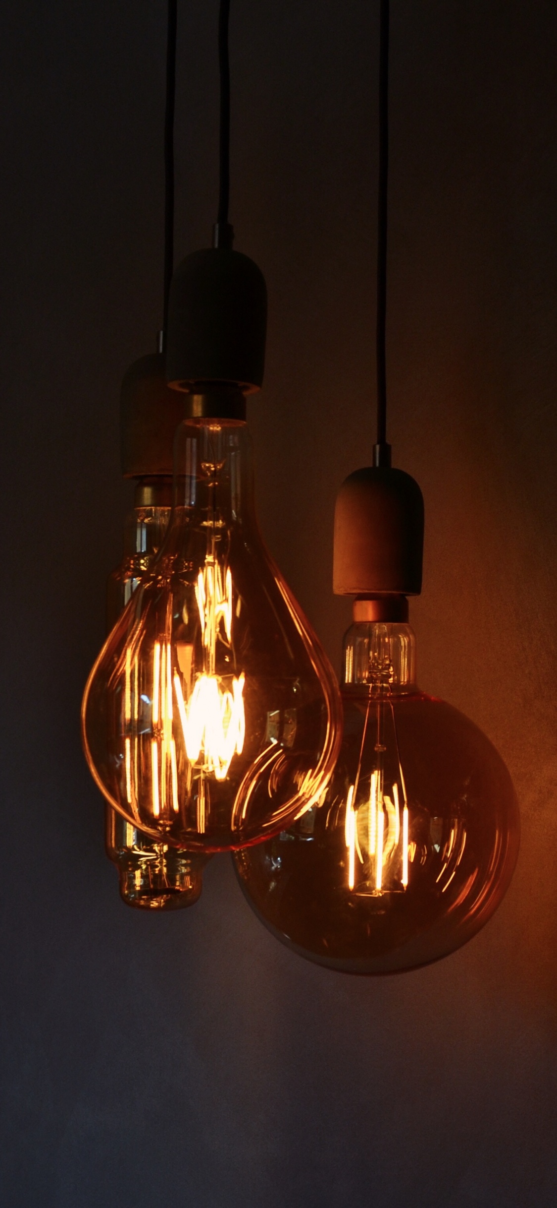 Brown and Yellow Light Bulb. Wallpaper in 1125x2436 Resolution